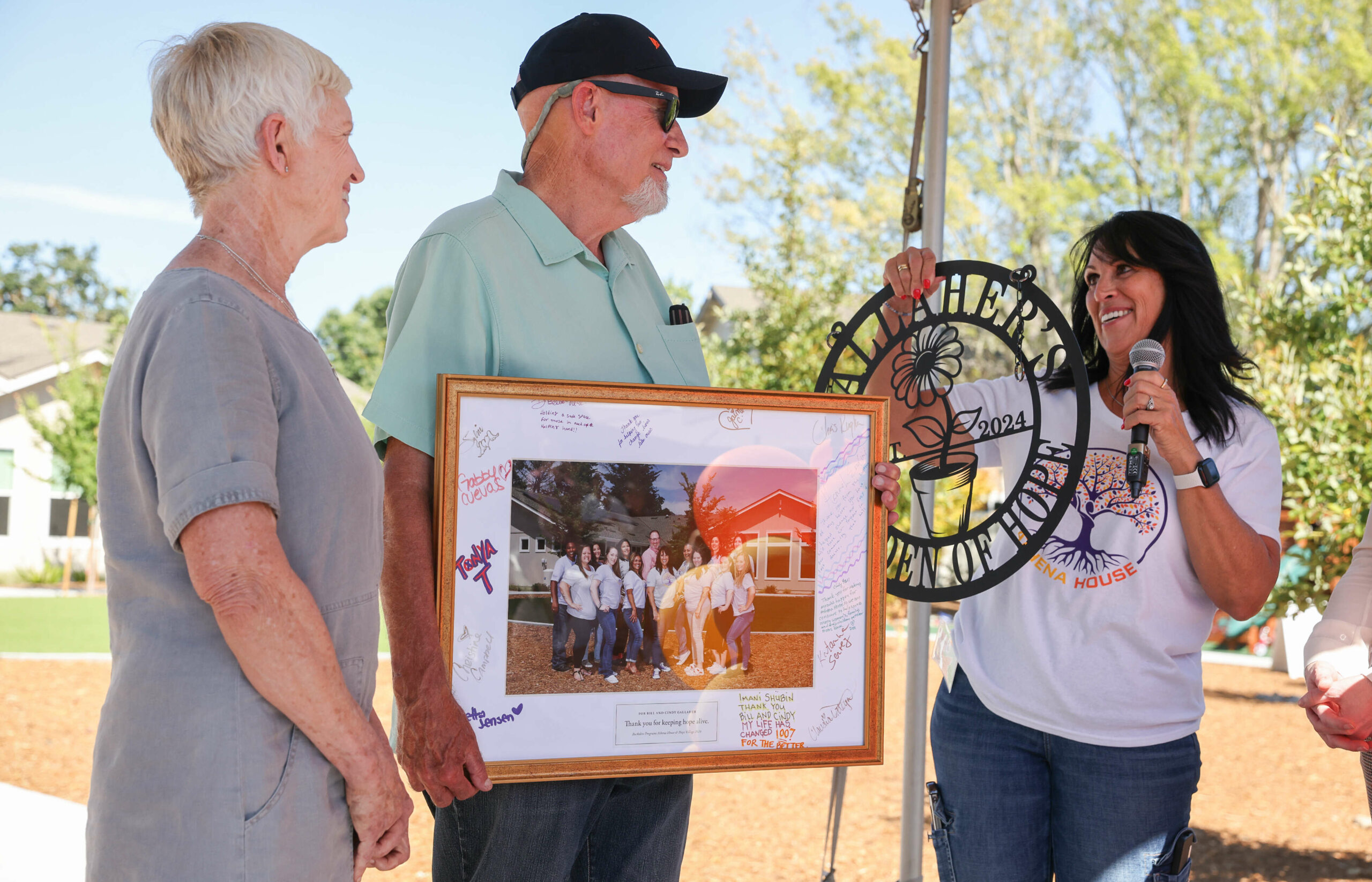 Sylvie De La Cruz, right, program director of Athena House...