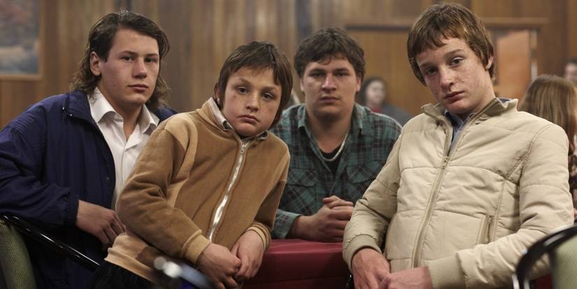 The boys of Snowtown (2011) sitting at a table looking straight ahead