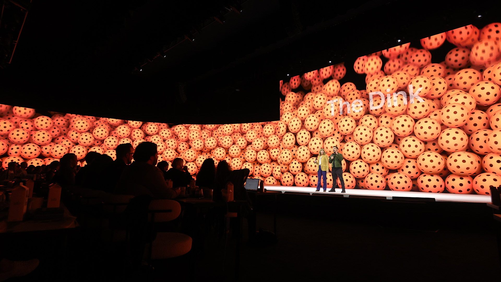 The cast of The Dink on stage at an Apple TV press event