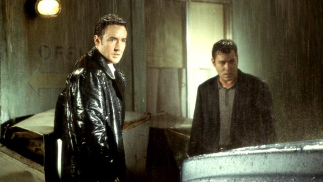 john-cusack-s-ed-and-ray-liotta-s-rhodes-stand-in-the-rain-in-james-mangold-s-identity.jpg