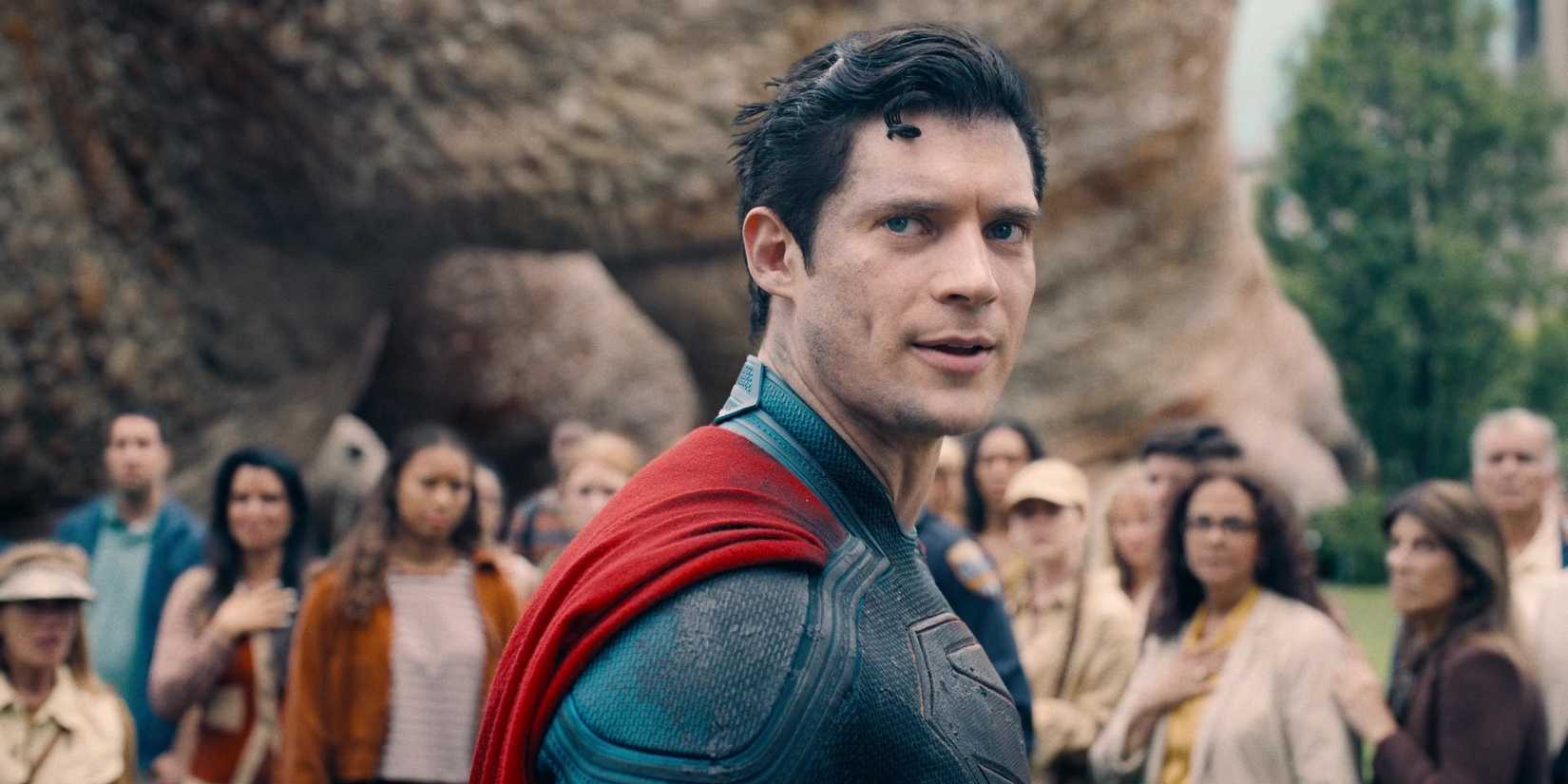David Corenswet as Superman in front of a crowd of people in Superman
