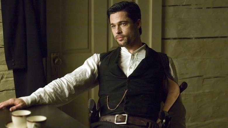 Brad Pitt as Jesse James, almost relaxing in The Assassination of Jesse James by the Coward Robert Ford