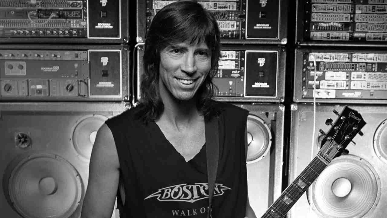 Boston&rsquo;s Tom Scholz posing for a photograph with a guitar in 1994
