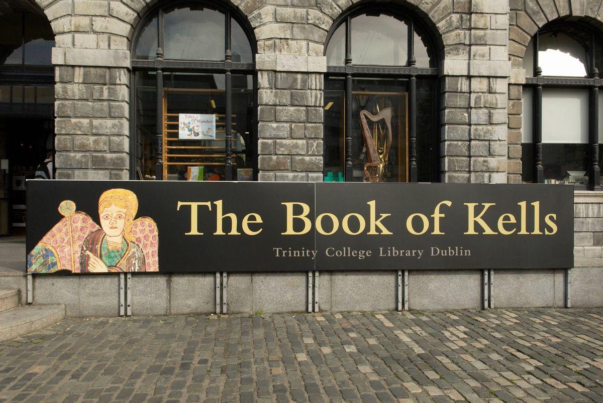 The Book of Kells banner advertising the outside the library of Trinity College in Dublin Ireland The oldest university in Ireland founded in 1592 by Queen Elizabeth I The treasures are on permanent public view. (Photo by: Universal Images Group via Getty