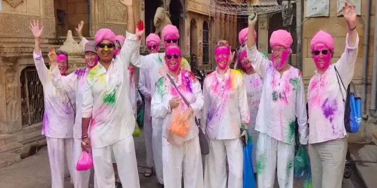 1772513556Foreign_Tourists_join_Holi.webp