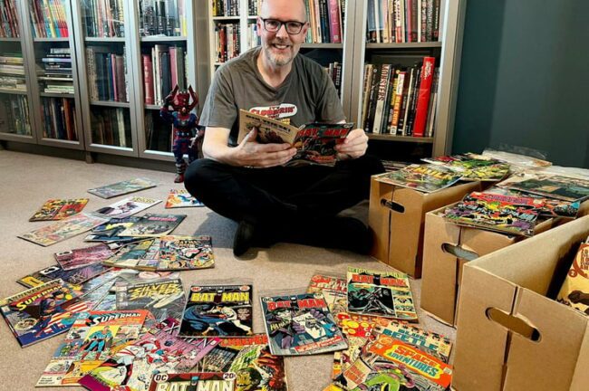 Comic-book-obsessed-Nigel-Kitching-with-some-of-his-comics.jpeg
