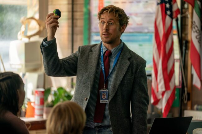 Ryan-Gosling-holding-a-ball-in-a-classroom-while-giving-a-lecture-as-Dr.-Ryland-Grace-in-the-sci-fi-film-Project-Hail-Mary.jpeg