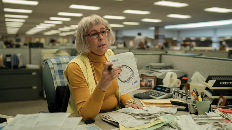Deirdre at the DMV holding up a receipt in Everything Everywhere All at Once