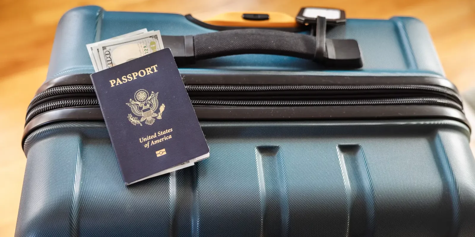 usa-passport-cash-suitcase-travel-shutterstock.webp