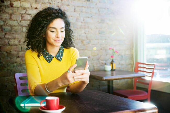 0_Woman-using-mobile-in-coffee-shop.jpg