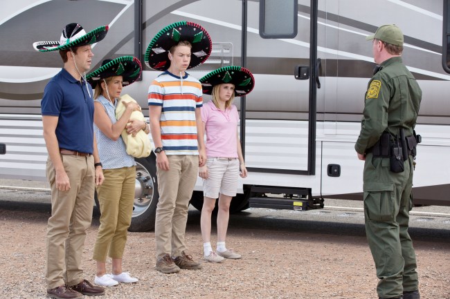 WE'RE THE MILLERS, facing right, from left: Jason Sudeikis, Jennifer Aniston, Will Poulter, Emma Roberts, 2013. ph: Michael Tackett/©Warner Bros. Pictures/courtesy Everett Collection