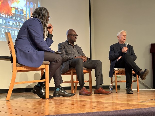 Leon Carroll Jr., center, and Mark Harmon answer questions about...