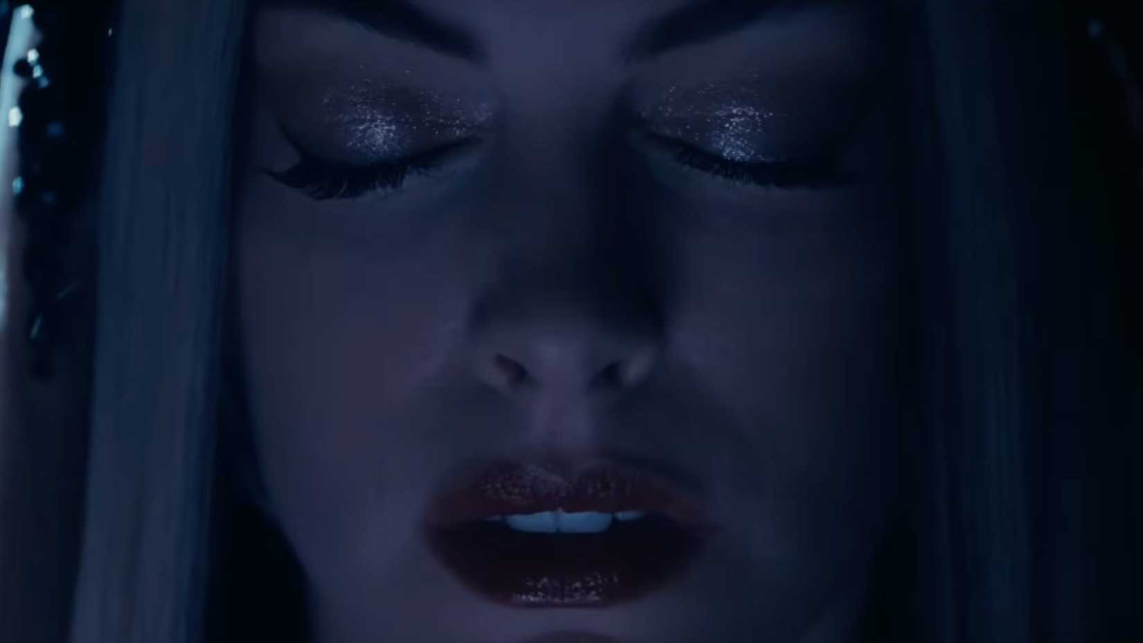 Anne Hathaway with her eyes closed in Mother Mary