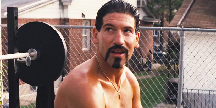 Jon Bernthal working out with bad facial hair in The Wolf of Wall Street.