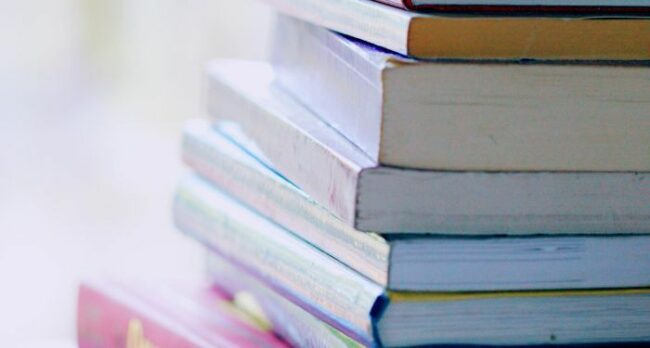stack-of-books-against-blurred-backdrop.jpg.optimal.jpg