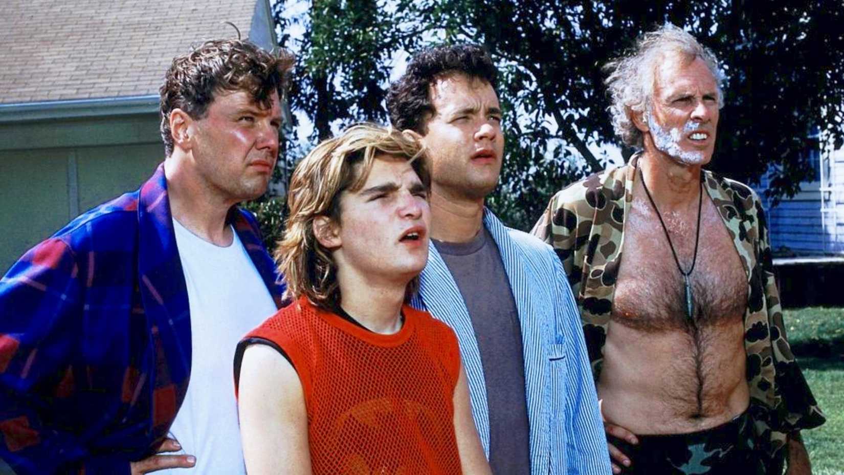 Ray and his neighbors look at the Klopek house in The Burbs