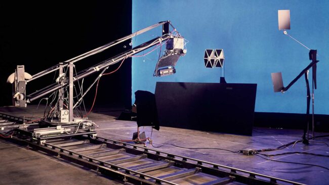 the-ilm-motional-control-rig-filming-a-tie-fighter-against-a-blue-screen.jpg