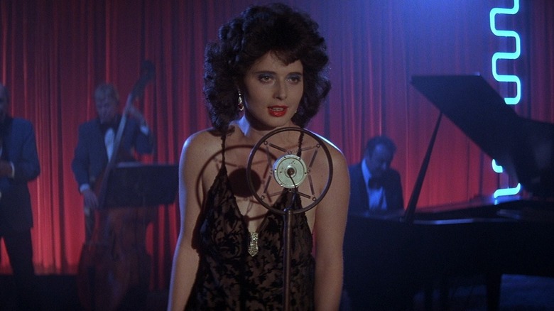 Dorothy Vallens at the mic singing in Blue Velvet