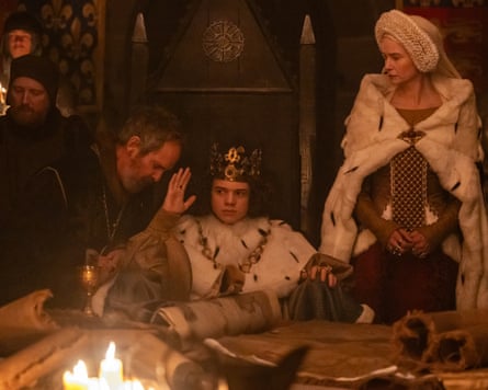 Medieval king sitting at table