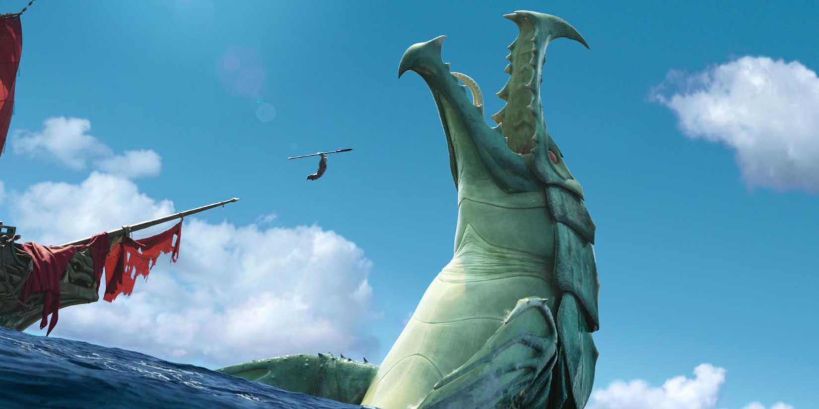 A small figure jumps at a massive green monster coming from the sea in The Sea Beast