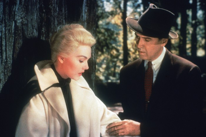 Vertigo James Stewart looks at Kim Novak in the woods in Alfred Hitchcock's Vertigo