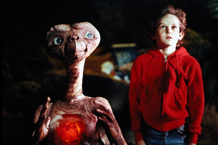 et-the-extraterrestrial Henry Thomas as Elliott in E.T. the Extraterrestrial stood next to ET