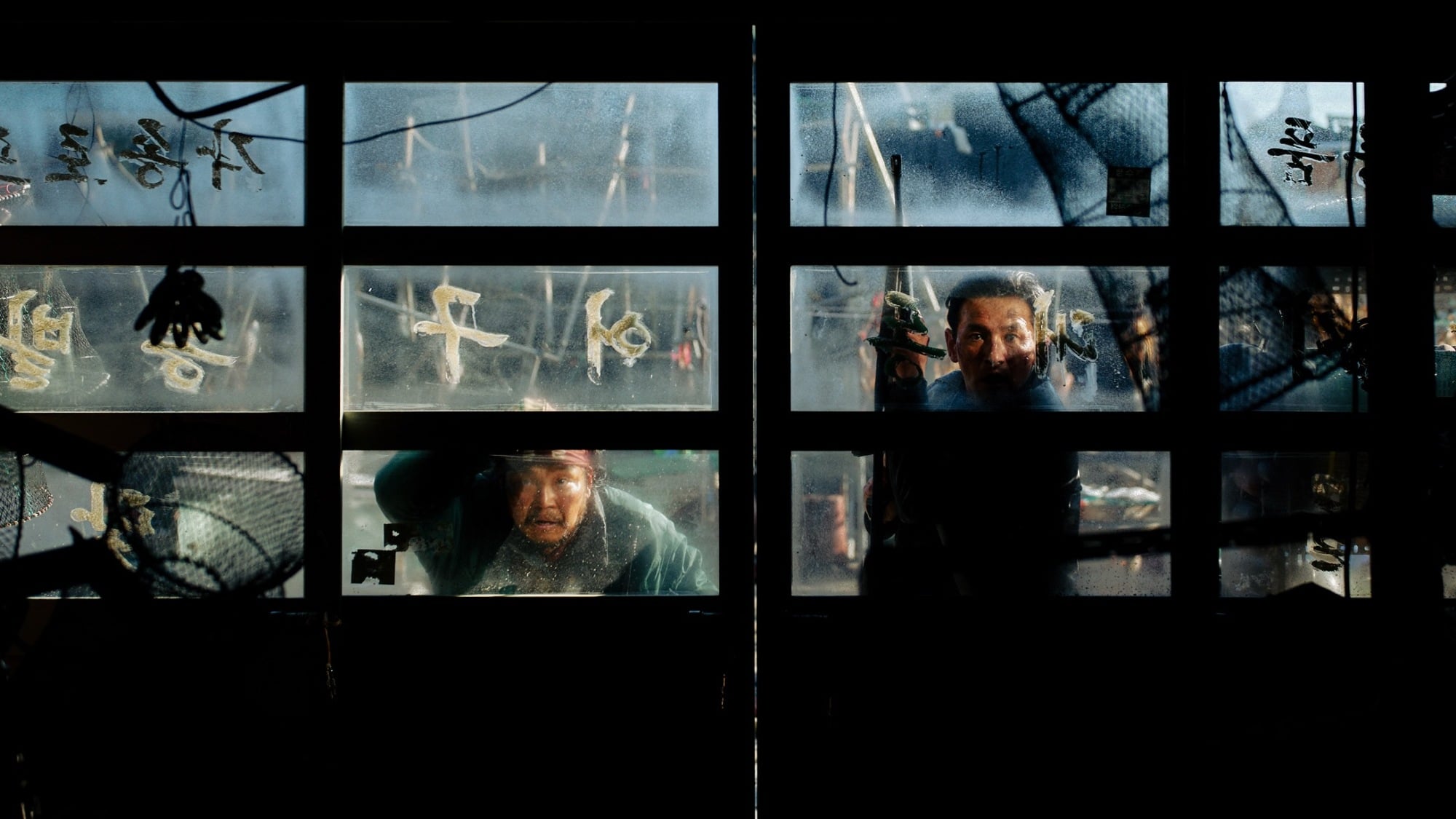 Police outpost chief Bum-seok (Hwang Jung-min) looks for a monster in 