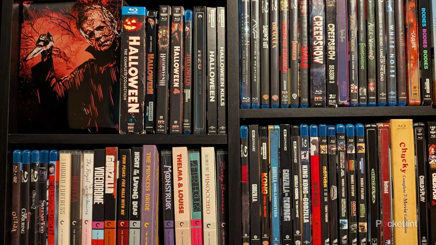 A collection of Blu-rays on a shelf.
