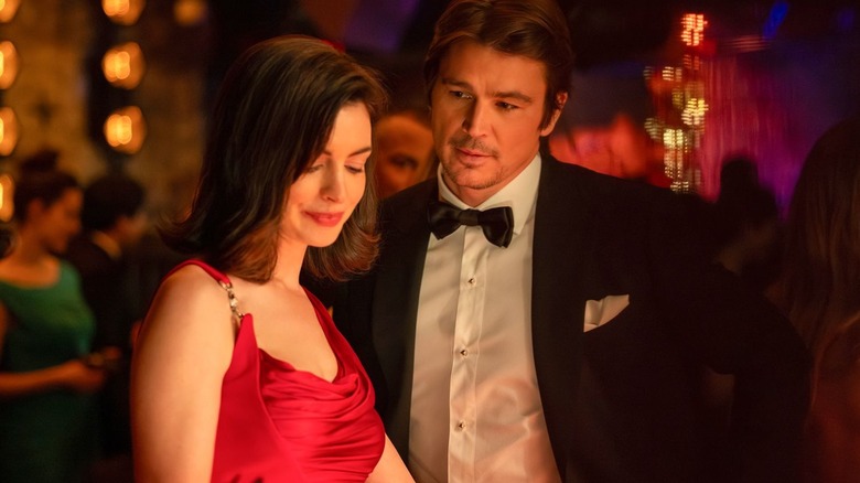 Verity and Jeremy at a party in formal wear in Verity