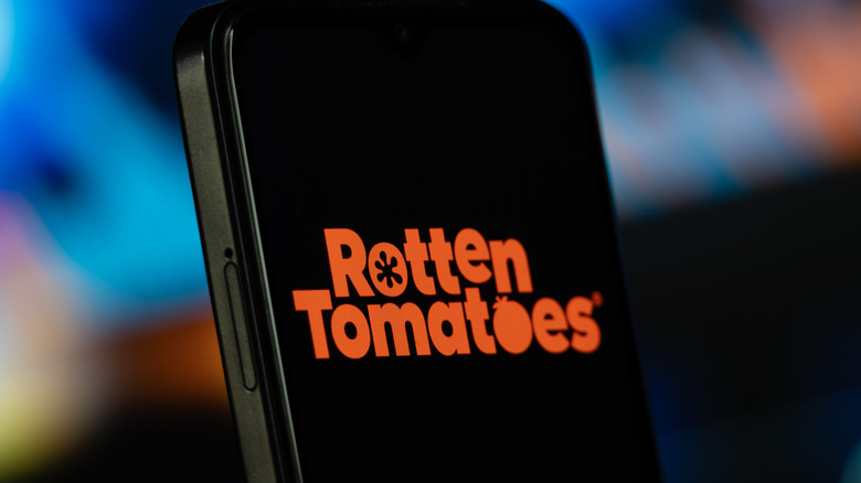 The Rotten Tomatoes movie rating logo on a smartphone