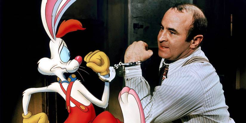 Bob Hoskins looks annoyed as he is handcuffed to Roger the cartoon rabbit in Who Framed Roger Rabbit