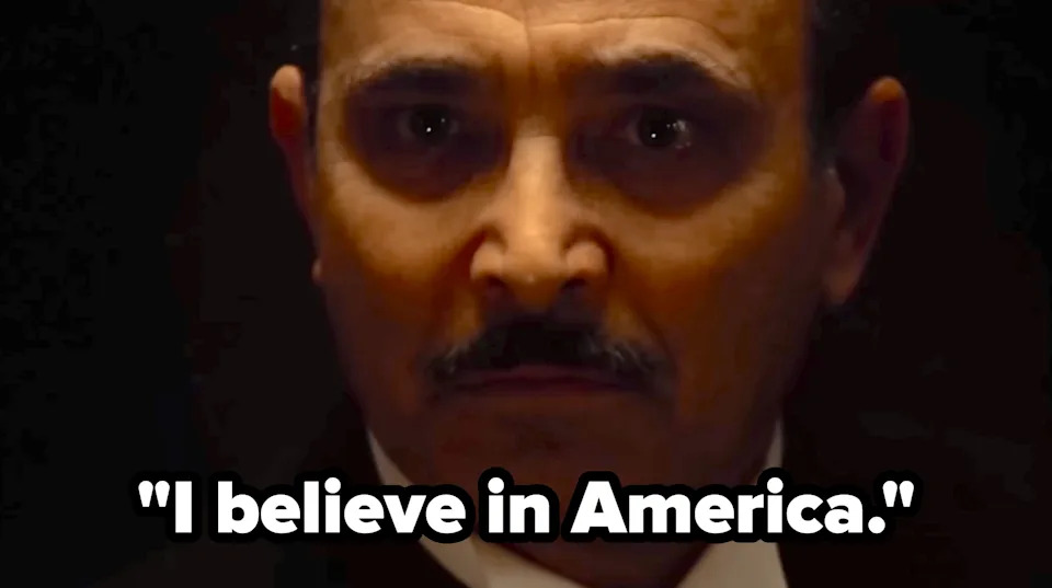 A man with a serious expression and mustache looks Text reads, 