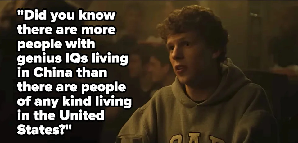 Jessie Eisenberg in a hoodie sits at a table, engaged in conversation in a dimly lit setting. Text reads, 