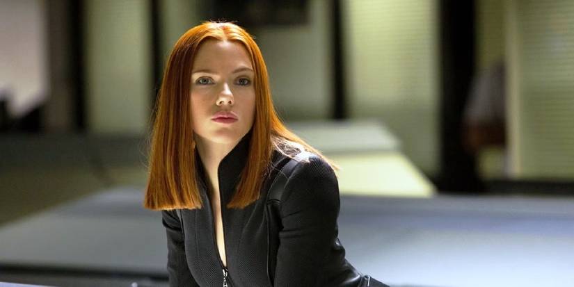 Black Widow looks at something with focus in Captain America: The Winter Soldier.